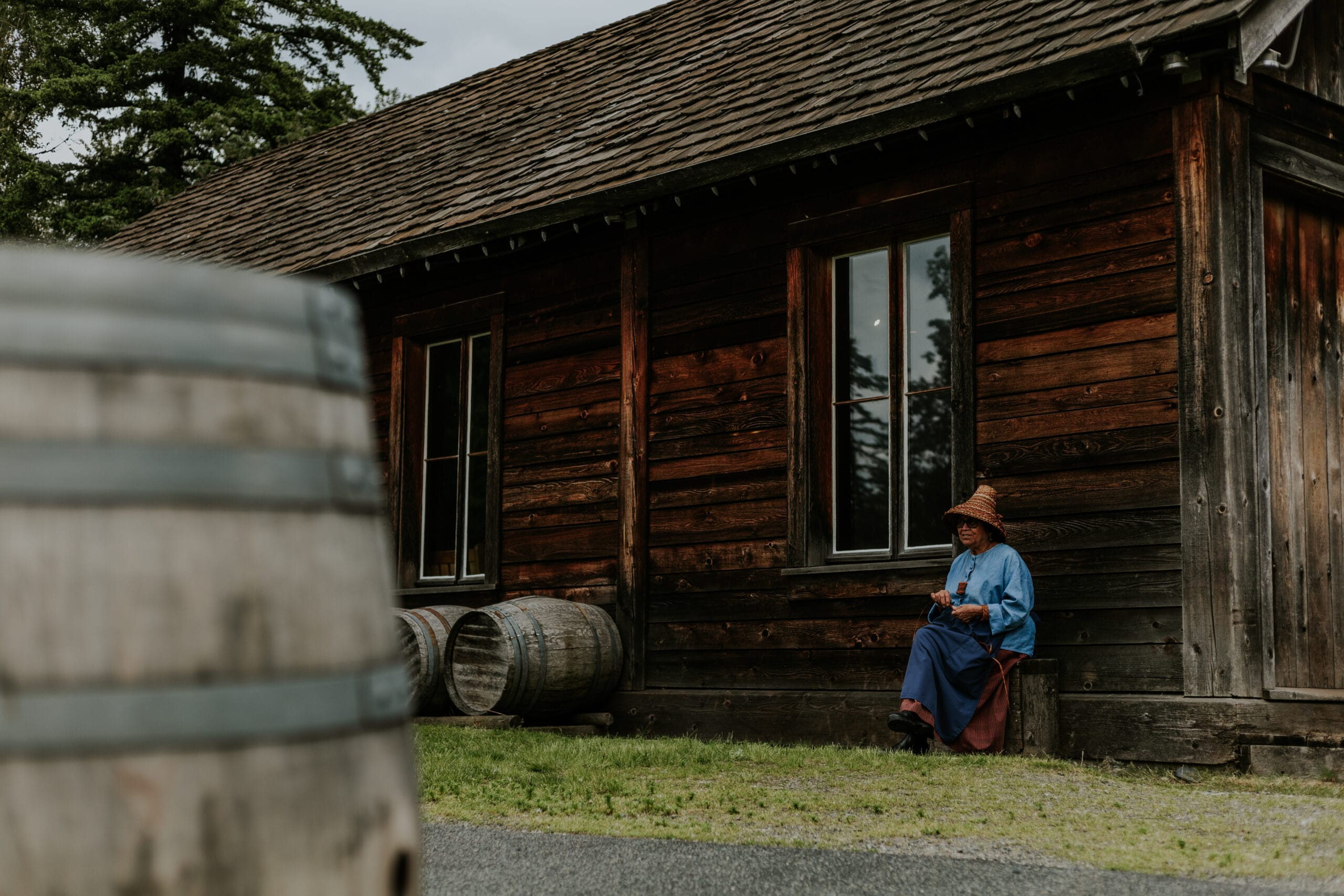 A woman sits in Fort Langley